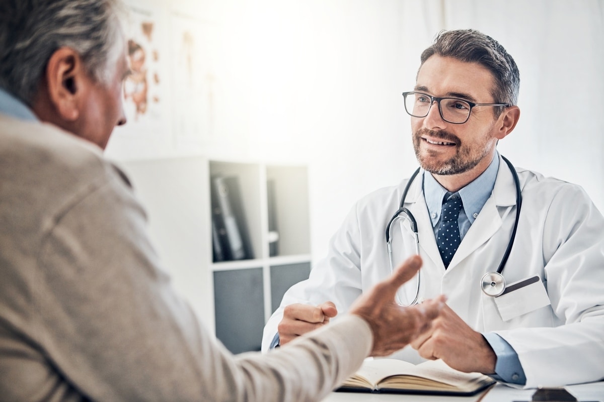 Doctor discussing testosterone replacement therapy in Ralston NE with male patient during consultation
